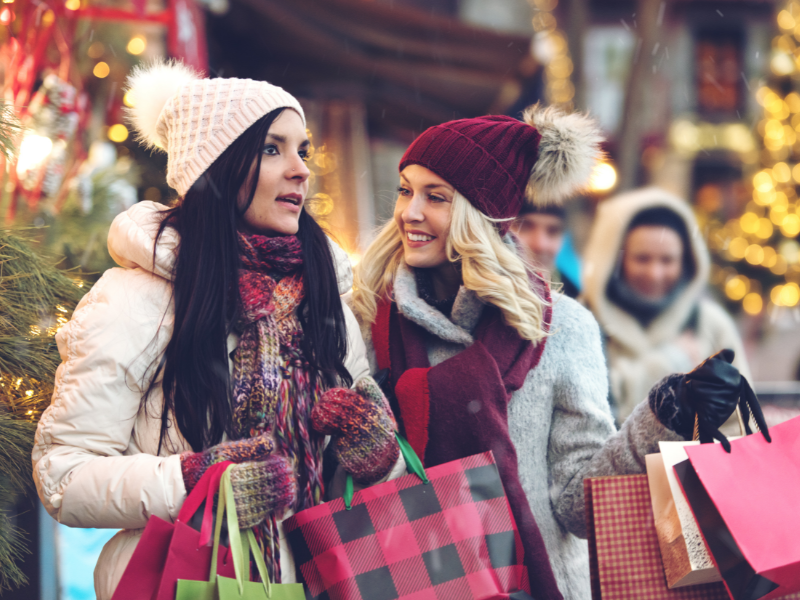 Two women doing Christmas shopping.