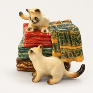 TMT Imports ceramic figurine of two cats on blankets